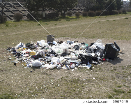 Household electrical appliances illegally dumped into a riverbed 6967649