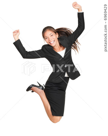 Celebrating businesswoman jumping Celebrating businesswoman jumping 6969429