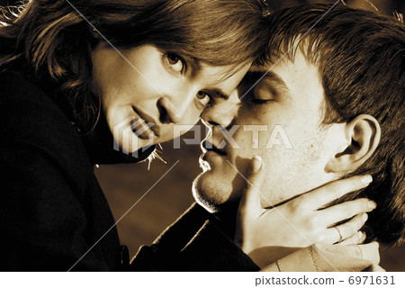 Close-up portrait of a young couple in love Close-up portrait of a young couple in love 6971631