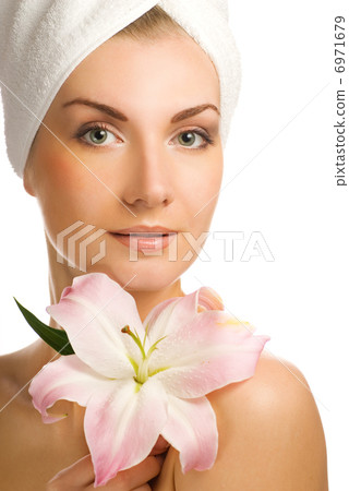 Beautiful young woman with pink lily Beautiful young woman with pink lily 6971679