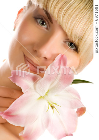 Beautiful woman with pink lily 6971681