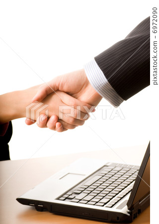 Business man and business woman making a treaty 6972090