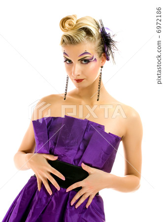 Beautiful woman in fashionable dress with creative hairstyle and 6972186