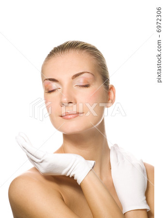 Lovely woman in moisturizing gloves 6972306