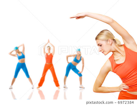 Group of women doing fitness exercise isolated on white. Lots of 6972384