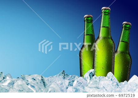 Beer Bottle with water drops on the white Beer Bottle with water drops on the white 6972519