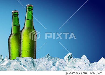 Beer Bottle with water drops on the white Beer Bottle with water drops on the white 6972524