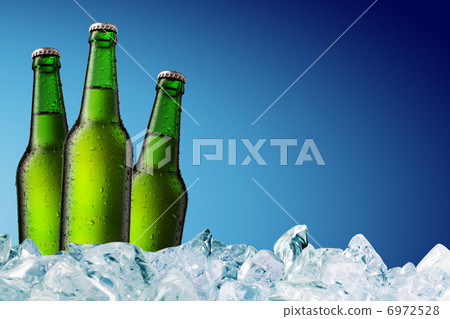 Beer Bottle with water drops on the white Beer Bottle with water drops on the white 6972528