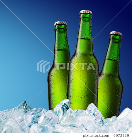 Beer Bottle with water drops on the white Beer Bottle with water drops on the white 6972529