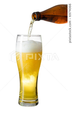 Topping up light beer from bottle to glass isolated on white 6974066