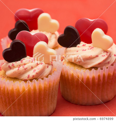 Close up of three valentines cupcakes 6974899