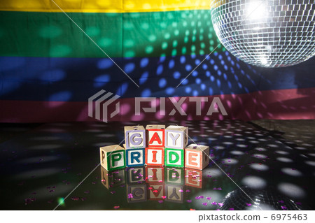 Block spelling gay pride under light of disco ball Block spelling gay pride under light of disco ball 6975463