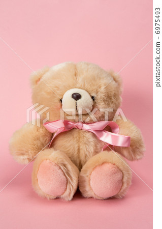 Teddy bear with pink ribbon 6975493