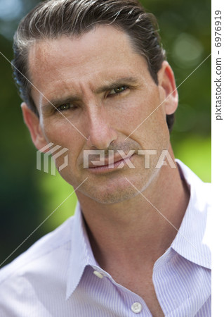 Outdoor Portrait of Handsome Middle Aged Man Outdoor Portrait of Handsome Middle Aged Man 6976919