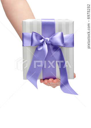 male holding gift box with a bow isolated on white background male holding gift box with a bow isolated on white background 6978282