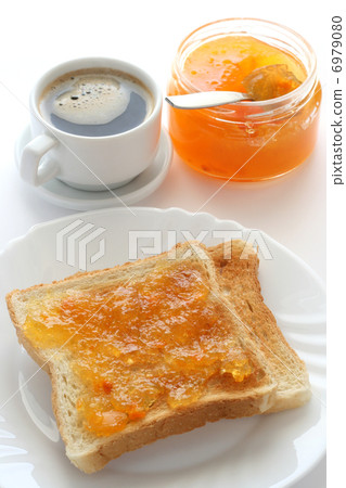 toast with jam and a cup of coffee toast with jam and a cup of coffee 6979080