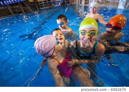 .happy moments at swimming pool with smilling childrens .happy moments at swimming pool with smilling childrens 6982670