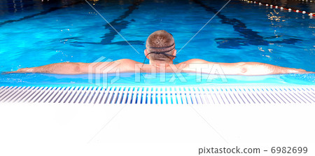 .swimmer with arms wide open 6982699