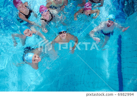 happy children group at swimming pool 6982994