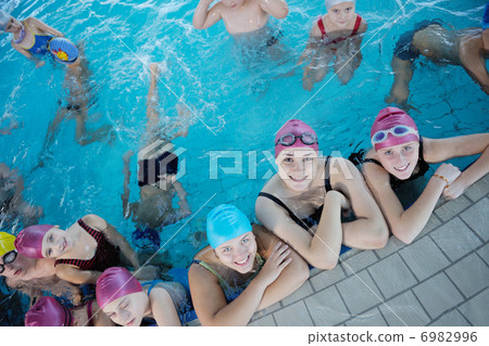 happy children group at swimming pool 6982996