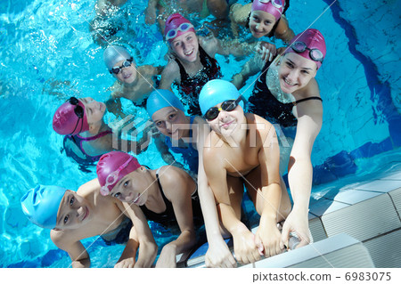 happy children group at swimming pool 6983075