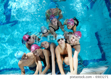 happy children group at swimming pool 6983271