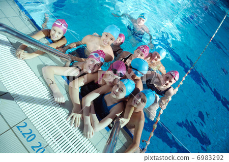 happy children group at swimming pool 6983292