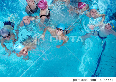 happy children group at swimming pool 6983334