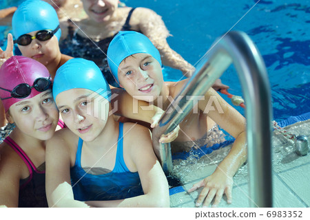 happy children group at swimming pool 6983352
