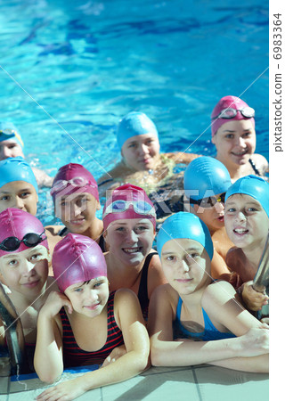 happy children group at swimming pool 6983364