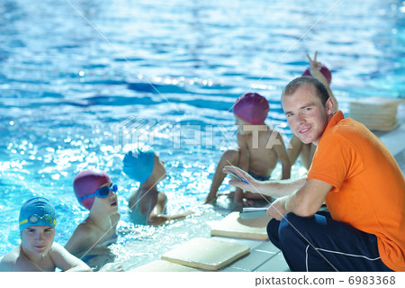 happy children group at swimming pool 6983368