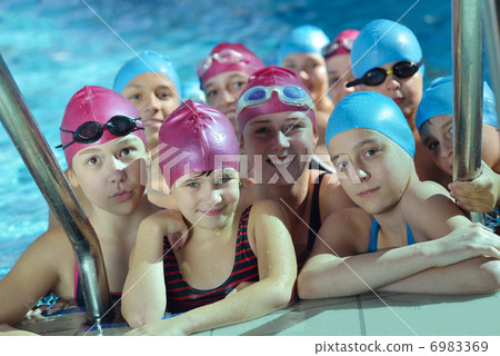 happy children group at swimming pool 6983369
