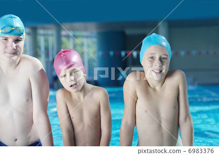 happy children group at swimming pool 6983376