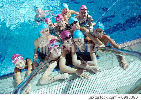 happy children group at swimming pool 6983380