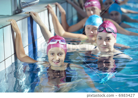 happy children group at swimming pool 6983427