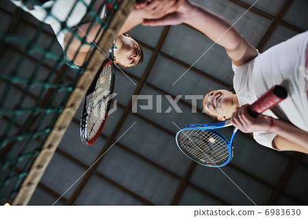 young girls playing tennis game indoor young girls playing tennis game indoor 6983630