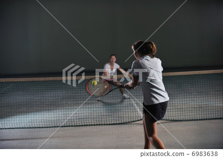 young girls playing tennis game indoor young girls playing tennis game indoor 6983638