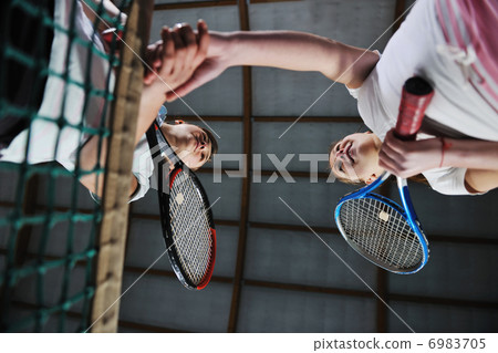 young girls playing tennis game indoor young girls playing tennis game indoor 6983705