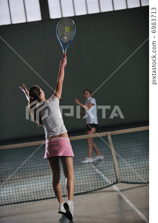 young girls playing tennis game indoor young girls playing tennis game indoor 6983713