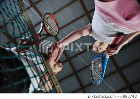 young girls playing tennis game indoor young girls playing tennis game indoor 6983748