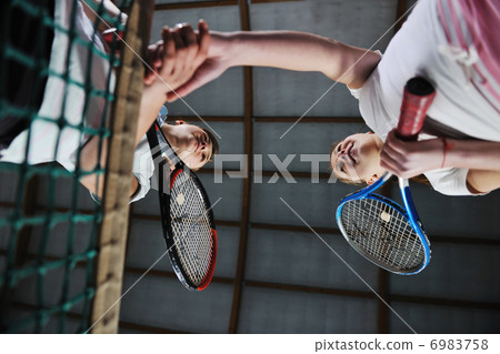 young girls playing tennis game indoor young girls playing tennis game indoor 6983758