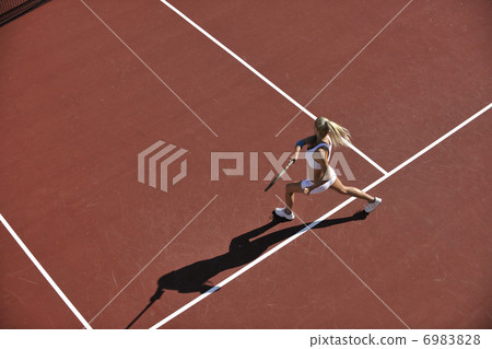 Stock Photo: young woman play tennis outdoor