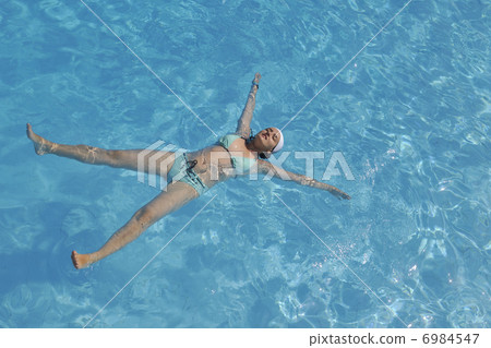 woman relax at swimming pool 6984547