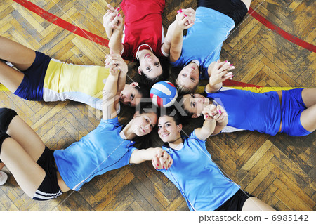 girls playing volleyball indoor game 6985142