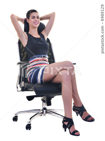 brunette female model posing on business chair 6989129