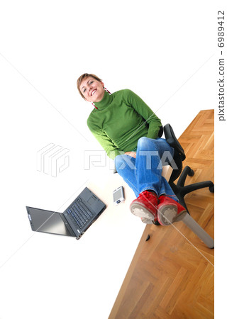 casual girl relaxing at the office casual girl relaxing at the office 6989412