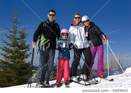 portrait of happy young family at winter 6989683
