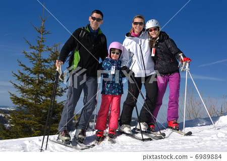 portrait of happy young family at winter portrait of happy young family at winter 6989884