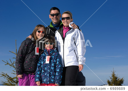 portrait of happy young family at winter portrait of happy young family at winter 6989889