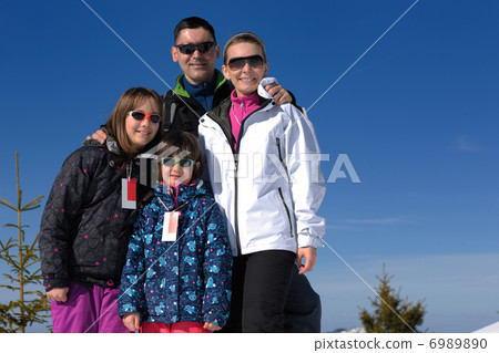 portrait of happy young family at winter portrait of happy young family at winter 6989890